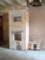 Masonry heater refractory core with bench and bypass.