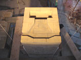 Under hearth smoke path of upper chamber oven.